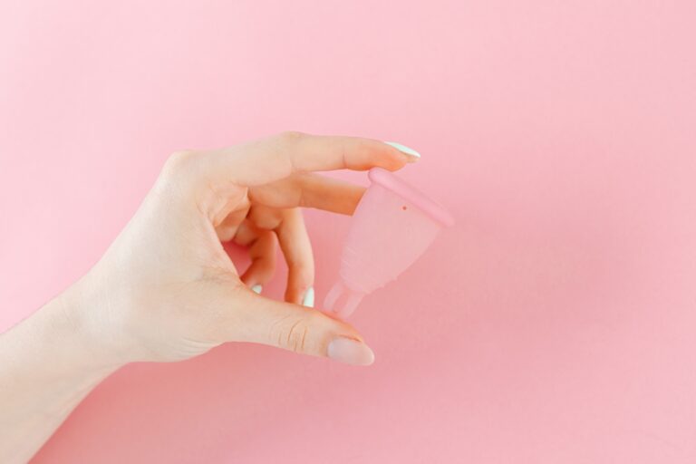 hand holding a menstrual cup