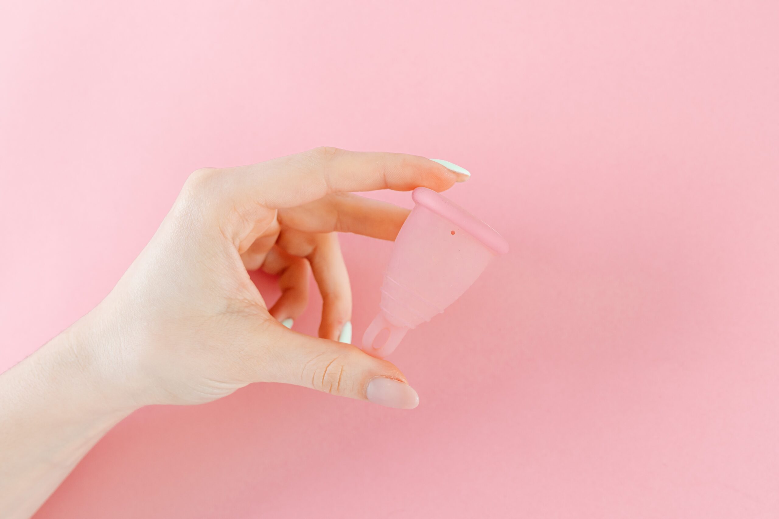 hand holding a menstrual cup