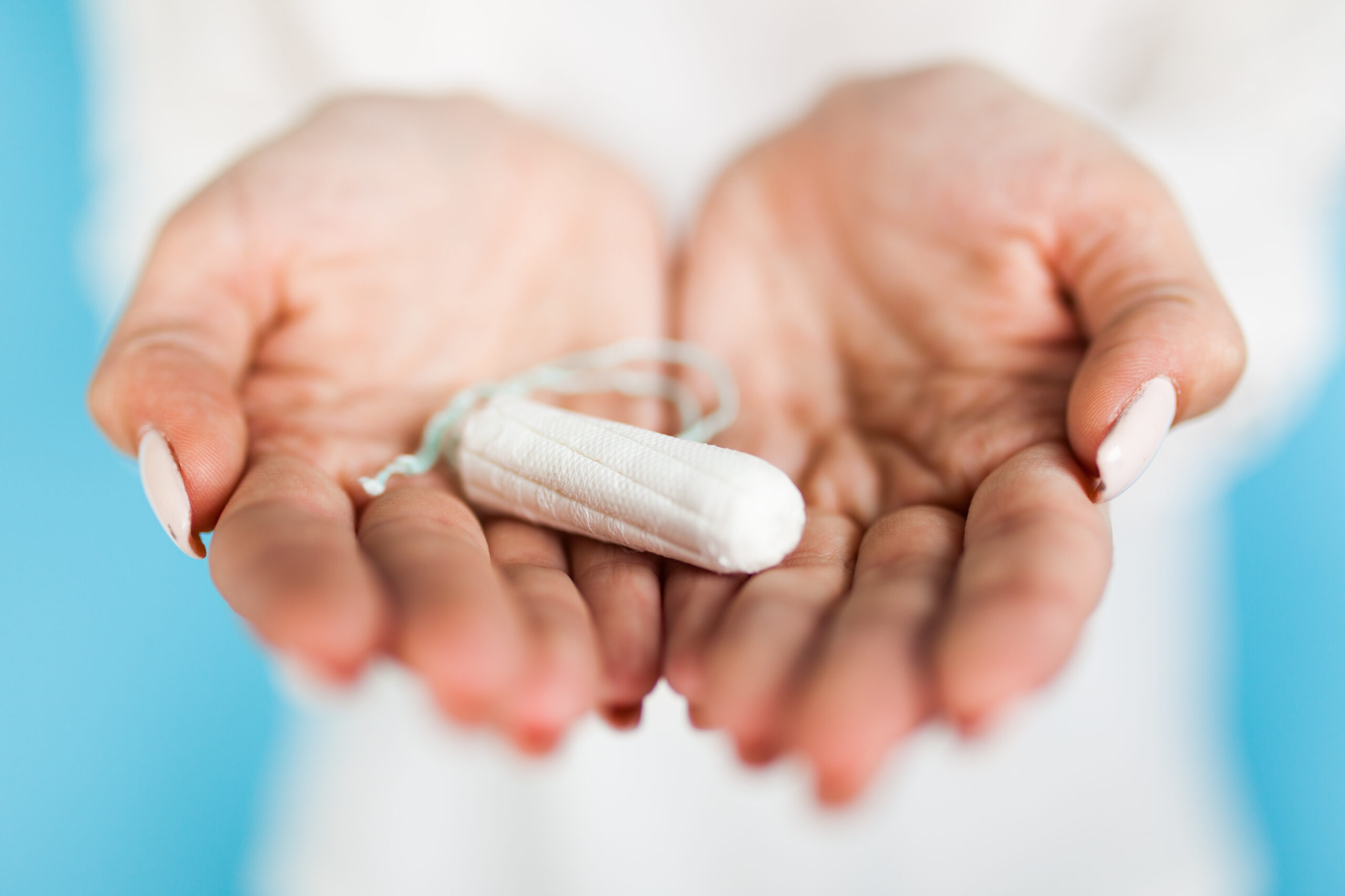 woman holding tampon with hand