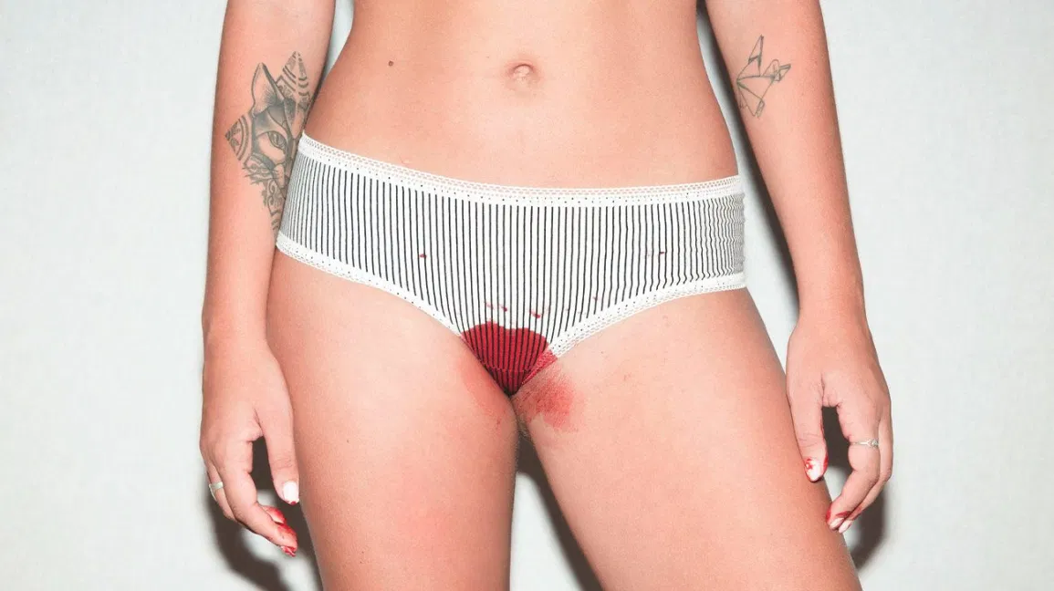 woman bleeding in underwear