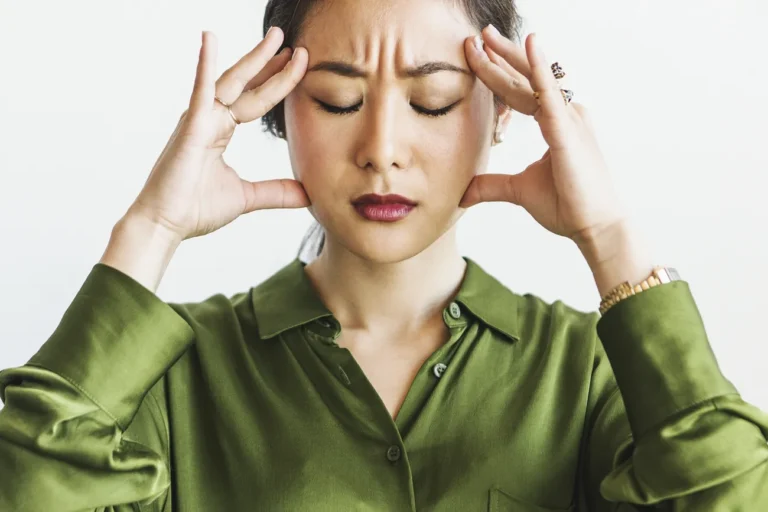 woman looking stressed from hormonal effects