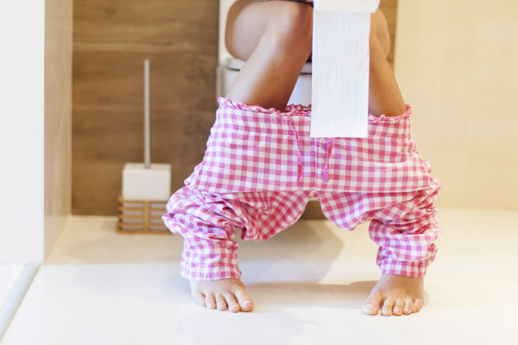 Close up of woman on toilet in morning