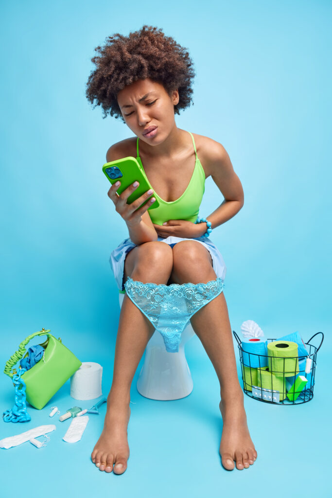woman using toilet